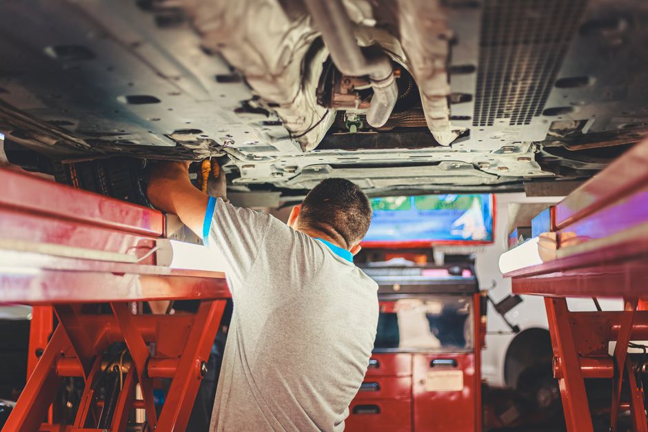 Professional car installation in service bay